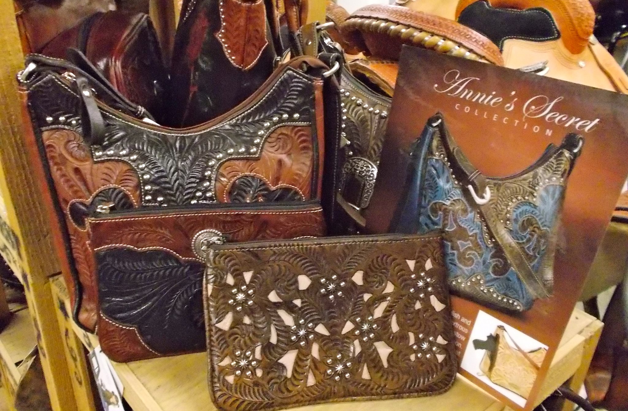 You will also find genuine leather purses and a complete line of men’s, women’s and kids belts.  Not to mention we have a large selection of home decor items like dishes, mugs, towels and more.