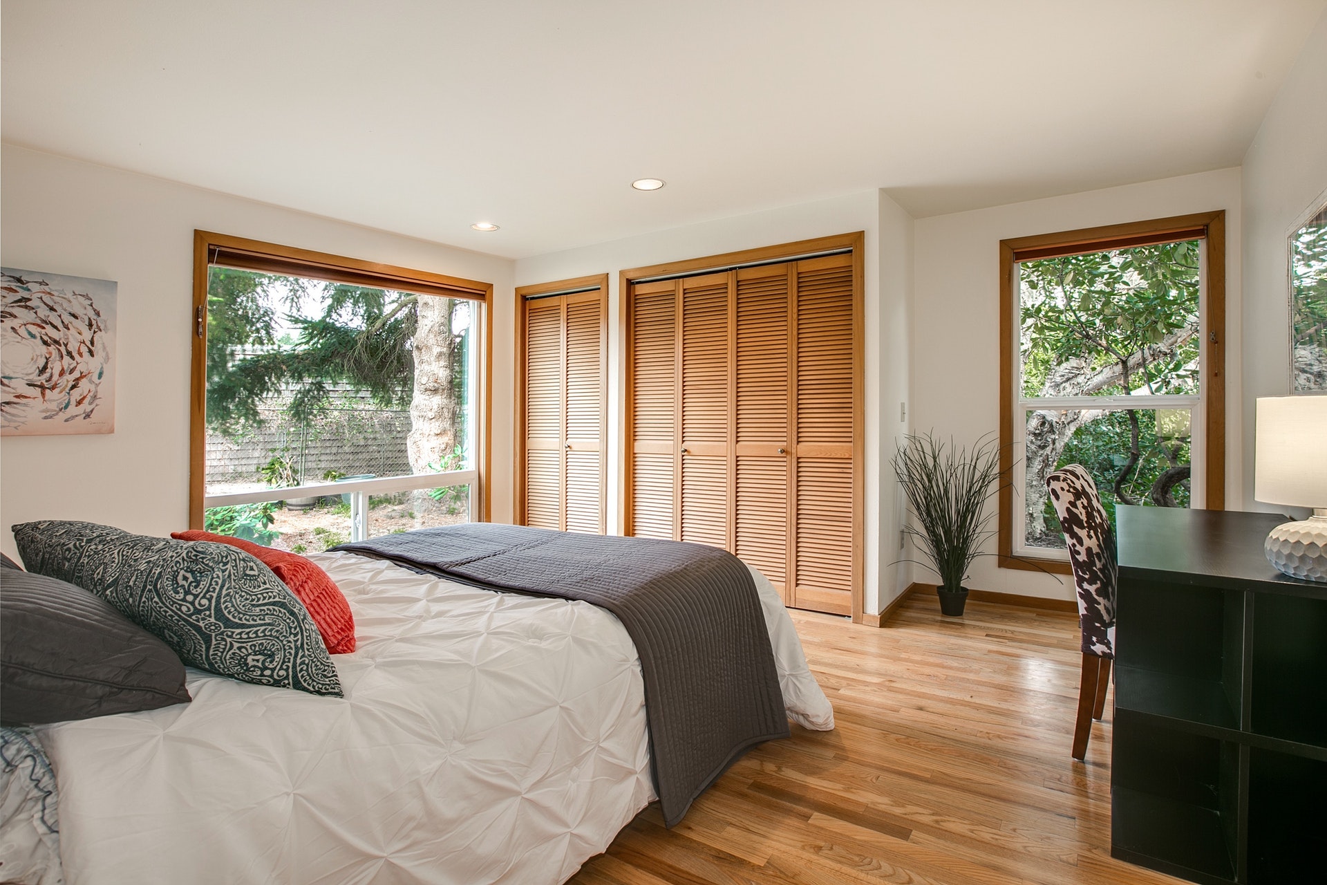 Lower level bedroom with it’s own private full bath boasts double pane UV filtered picture windows letting all the beauty of the outdoors in.